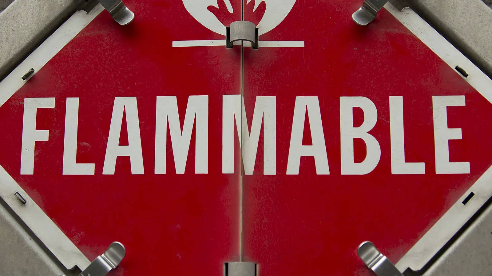 A red flammable hazardous-materials placard on a trailer.
